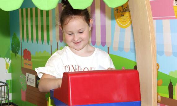 Child having fun playing games in the Play Room at Walsall Hospital