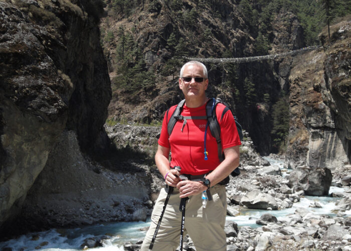 Picture of Colin Horn, Managing Director and founder of Grosvenor Interiors hiking in the mountains.