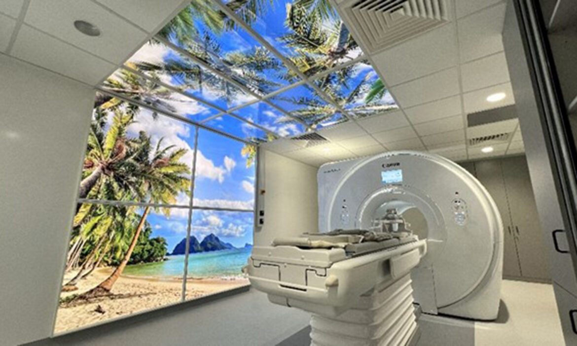 MRI Scanner with LED sky and wall panels illuminated.